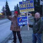 Heath Smith, right, Candidate for State Senate District C, waves signs on Tuesday, Nov. 8, 2022, on Pioneer Avenue in Homer, Alaska. At left, Charlie Franz shows his support for Rep. Sarah Vance, running for re-election and for the new District 6. (Photo by Michael Armstrong/Homer News)
