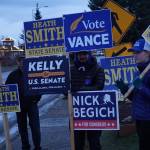 Republican Party supporters wave signs on Tuesday, Nov. 8. 2022, on Pioneer Avenue in Homer, Alaska, in support of Republican Party candidates Rep. Sarah Vance, R-Homer, Heath Smith, running for State Senate District C, Kelly Tshibaka, running for U.S. Senate, and Nick Begich III, running for U.S. Congress. (Photo by Michael Armstrong/Homer News)