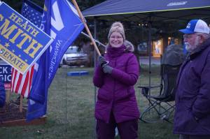 Rep. Sarah Vance, R-Homer, waves a campaign flag on Tuesday, Nov. 8, 2022, at WKFL Park in Homer, Alaska. Vance was part of a group supporting Republican Party candidates including Heath Smith, running for State Senate District C, Kelly Tshibaka, running for U.S. Senate, and Nick Begich III, running for U.S. Congress. (Photo by Michael Armstrong/Homer News)
