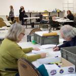 Mark Sabbatini / Juneau Empire
Pat Tynan, left, and Tom Melville, review absentee ballots Tuesday at the Division of Elections office at the Mendenhall Mall. The review process is taking place in a separate room from where ballots are being tallied for the official results.