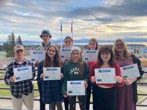 Owen Pitzman, Elias Allen, Dani Burge, Brooke Shafer, Dani Stiles, Eryn Field, Chloe Gall, and Charity Martin pose with their award certificates at Homer High School in Homer. (Photo provided)