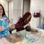 Mother and daughter Rachel and Audrey Bartel hand build pumpkins on Nov. 3, 2022, at the Homer Council on the Art's new ceramics studio in Homer, Alaska. (Photo provided)