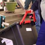 Clarise Larson / Juneau Empire
Frank Hughes pulls a tote filled with Alaska Native artifacts off the baggage carousel at the Juneau International Airport Thursday afternoon.