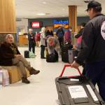 A black tote holding Alaska Native artifacts sits on the ground of the Juneau International Airport Thursday afternoon. It was flown from Seattle after being filled with 25 Alaska Native artifacts held at George Fox University in Oregon. ( Clarise Larson / Juneau Empire)