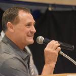 Neldon Gardner speaks while being inducted to the National Wrestling Hall of Fame following the duel wrestling meet on Tuesday, Nov. 22, 2022, at Soldotna High School in Soldotna, Alaska. (Jake Dye/Peninsula Clarion)