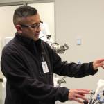Dr. Michael Reyes manipulates ROSA during a demonstration at Central Peninsula Hospital on Monday, Nov. 21, 2022, in Soldotna, Alaska. (Ashlyn OHara/Peninsula Clarion)