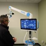 Dr. Michael Reyes reads data off of ROSA during a demonstration of a knee replacement surgery at Central Peninsula Hospital on Monday, Nov. 21, 2022, in Soldotna, Alaska. (Ashlyn OHara/Peninsula Clarion)