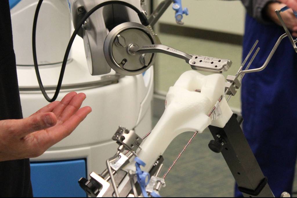 Dr. Michael Reyes manipulates ROSA during a demonstration at Central Peninsula Hospital on Monday, Nov. 21, 2022, in Soldotna, Alaska. (Ashlyn OHara/Peninsula Clarion)
