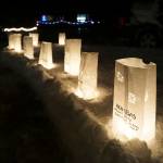 Rows of luminarias line the path at Light Up a Life, a fundraiser for Hospice of Homer, on Thursday, Dec. 15, 2022, at WKFL Park in Homer, Alaska. (Photo by Michael Armstrong/Homer News)
