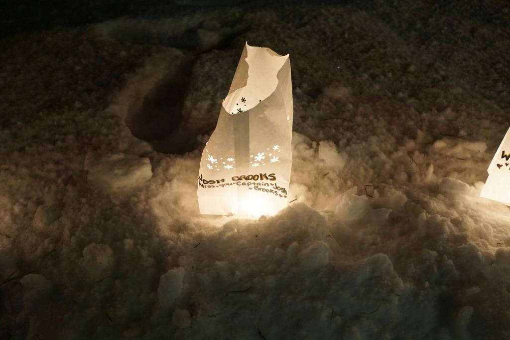 A luminaria in honor of Capt. Josh Brooks, a charter fishing captain who died in 2021, was one of the lanterns put up at Light Up a Life, a fundraiser for Hospice of Homer, on Thursday, Dec. 15, 2022, at WKFL Park in Homer, Alaska. (Photo by Michael Armstrong/Homer News)