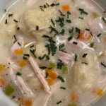 Onions, carrots and chicken broth are topped off with warm dumplings in this classic recipe. (Photo by Tressa Dale/Peninsula Clarion)