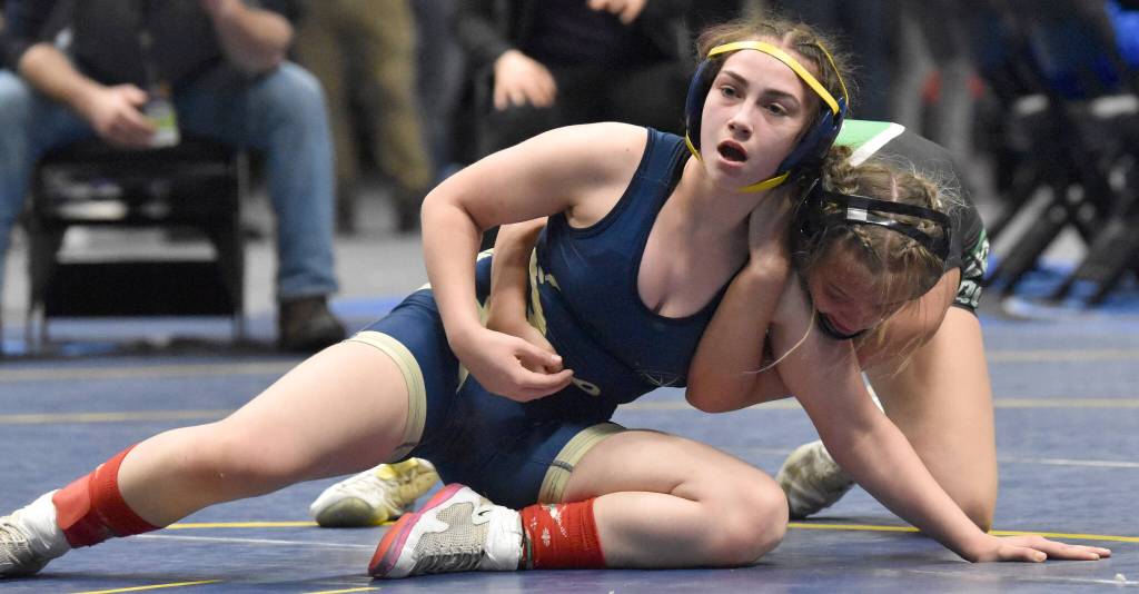Photo by Jeff Helminiak/Peninsula Clarion 
Homers Saoirse Cook defeats Colonys Bayleigh Harrington for the Girls state title at 126 pounds Saturday, Dec. 18, 2022, at the state wrestling tournament at the Alaska Airlines Center in Anchorage, Alaska.