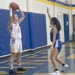 Photo by Jeff Helminiak/Peninsula Clarion 
Homers Minadora Reutrov looks to inbound the ball against Nome on Saturday, Dec. 17, 2022, at Homer High School in Homer, Alaska.