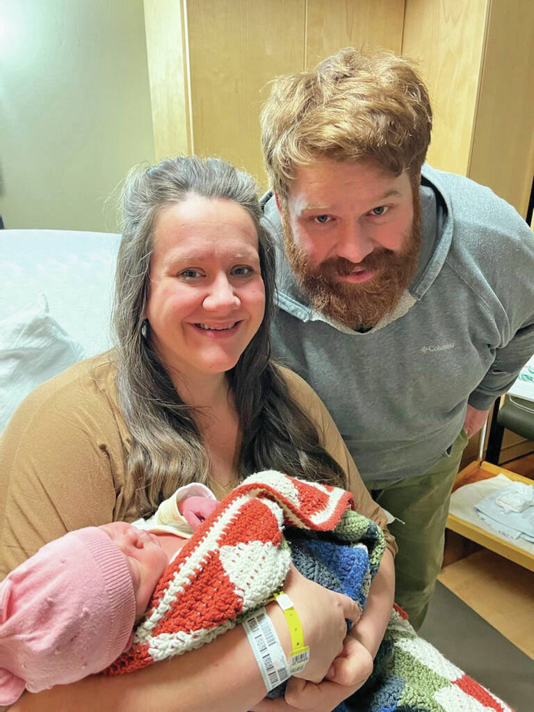 Cassy Quinlan, left, holds her new daughter, Betty Lynn Fraley, while father Jacob Fraley, right, watches on Wednesday, Jan. 19, at South Peninsula Hospital in Homer. Betty Lynn was born on Jan. 17 , the first baby of the New Year. (Photo courtesy of South Peninsula Hospital)