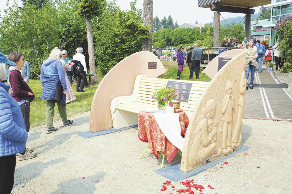 Photo by Michael Armstrong/Homer News 
People visit at the Loved & Lost Memorial Bench on Sunday, June 12, at the Homer Public Library for a memorial for Anesha Duffy Murnane and the dedication of the bench.