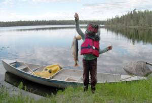 My daughter with our catch of one char (the largest fish) and two trout at Drake Lake, June 17, 2012. (Photo by Matt Bowser)