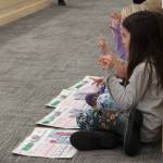 Mountain View Elementary School students use their hands to build works using methodology from the University of Florida Literacy Institute during a board of education meeting on Monday, Dec. 5, 2022, in Soldotna, Alaska. (Ashlyn OHara/Peninsula Clarion)