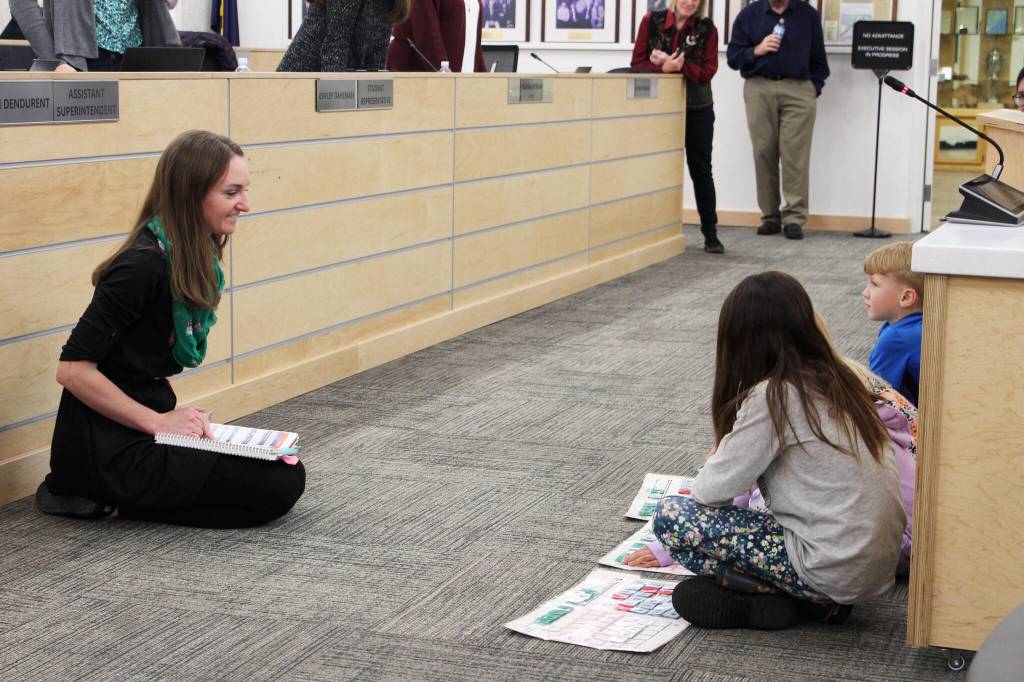 Mountain View Elementary School teacher Callie Giordano demonstrates with students word building with practices from the University of Florida Literacy Institute during a board of education meeting on Monday, Dec. 5, 2022, in Soldotna, Alaska. (Ashlyn OHara/Peninsula Clarion)