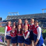 Members of the Kenai Central High School cheerleading team (back row, left to right): Kaitlyn Taylor, Sylvia McGraw, Malena Grieme, Maya Montague, Cali Holmes and Genesis Trevino; (front row, left to right): Makenzie Harden, Ella Romero and Brooklyn Reed stand for a photo at the Cheez-It Citrus Bowl on Monday, Jan. 1, 2023, at Camping World Stadium in Orlando, Florida. (Photo courtesy Brianna Force)
