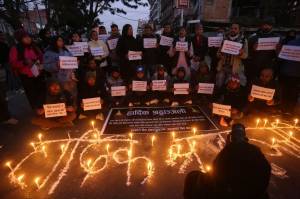 People observe a candlelight vigil in memory of victims of a plane crash in Kathmandu, Nepal, Monday, Jan. 16, 2023. (AP Photo/Bikram Rai)