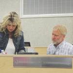 Acting Kenai Peninsula Borough Clerk Michele Turner helps newly sworn-in assembly member Peter Ribbens set up assembly materials on Tuesday, Jan. 17, 2023, in Soldotna, Alaska. (Ashlyn O'Hara/Peninsula Clarion)