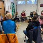 A broom-making workshop at Grace Ridge Brewing with Willow Q Jones, (center), Jan. 22, 2023, in Homer, Alaska. (Photo by Christina Whiting)