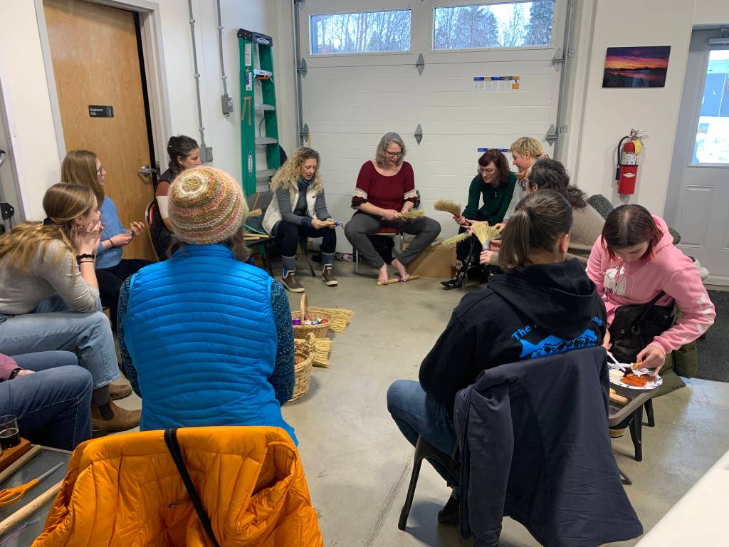 A broom-making workshop at Grace Ridge Brewing with Willow Q Jones, (center), Jan. 22, 2023, in Homer, Alaska. (Photo by Christina Whiting)