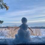 A tiny snowman looks out over Beluga Slough from the Calvin and Coyle trail, Jan. 21, 2023, in Homer, Alaska. (Photo by Christina Whiting)
