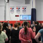 Women take an oath at a Toss A Cop event at the All American Training Center on Saturday, Jan. 21, 2023, in Soldotna, Alaska. (Ashlyn OHara/Peninsula Clarion)