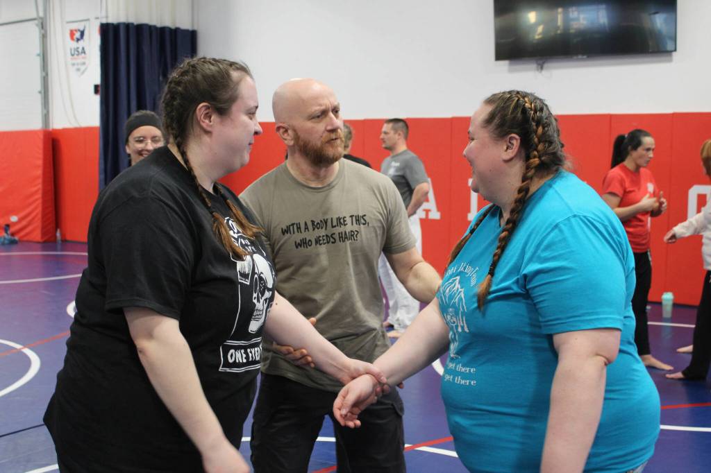 Soldotna Police Chief Gene Meek (center) speaks to attendees during a Toss A Cop event at the All American Training Center on Saturday, Jan. 21, 2023, in Soldotna, Alaska. (Ashlyn OHara/Peninsula Clarion)