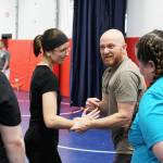 Soldotna Police Chief Gene Meek leads attendees in exercises during a Toss A Cop event at the All American Training Center on Saturday, Jan. 21, 2023, in Soldotna, Alaska. (Ashlyn OHara/Peninsula Clarion)