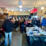 Community members gathered at the Down East Saloon last Saturday for a benefit for the Pariyar Family who lost their loved one, Hari (Bola) in the Nepal plane crash last month, with more than $5,000 raised. (Photo by Christina Whiting/Homer News)