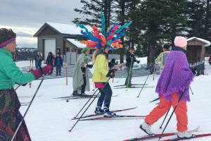 Krista Etzwiler skies dressed as a Dale Chihuly sculpture at the start of the Ski for Women on Sunday, Feb. 3, 2019 at the Lookout Mountain Trails near Homer, Alaska. Etzwiler won for best individual costume. (Photo by Megan Pacer/Homer News)