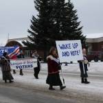 The Central Kenai Peninsula League of Women Voters march down Pioneer Avenue in the 69th annual Winter Carnival Parade on Saturday, Feb. 11, 2023 in Homer, Alaska. Photo by Delcenia Cosman