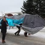 The Kachemak Bay Campus Student Association march with their mascot, Harmony the Whale, down Pioneer Avenue in the 69th Annual Winter Carnival Parade on Saturday, Feb. 11, 2023 in Homer, Alaska. Photo by Delcenia Cosman