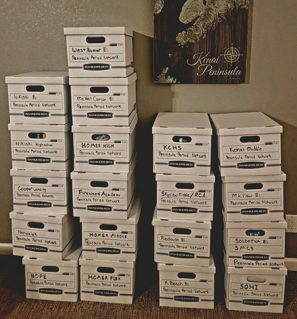 Boxes of period products are stacked, each destined for a specific school. (Photo courtesy Chera Wackler)