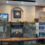 Paintings by Counsel Langely are on display at the Homer Public Library through March, as seen Feb. 11, 2023. (Photo by Christina Whiting/Homer News)