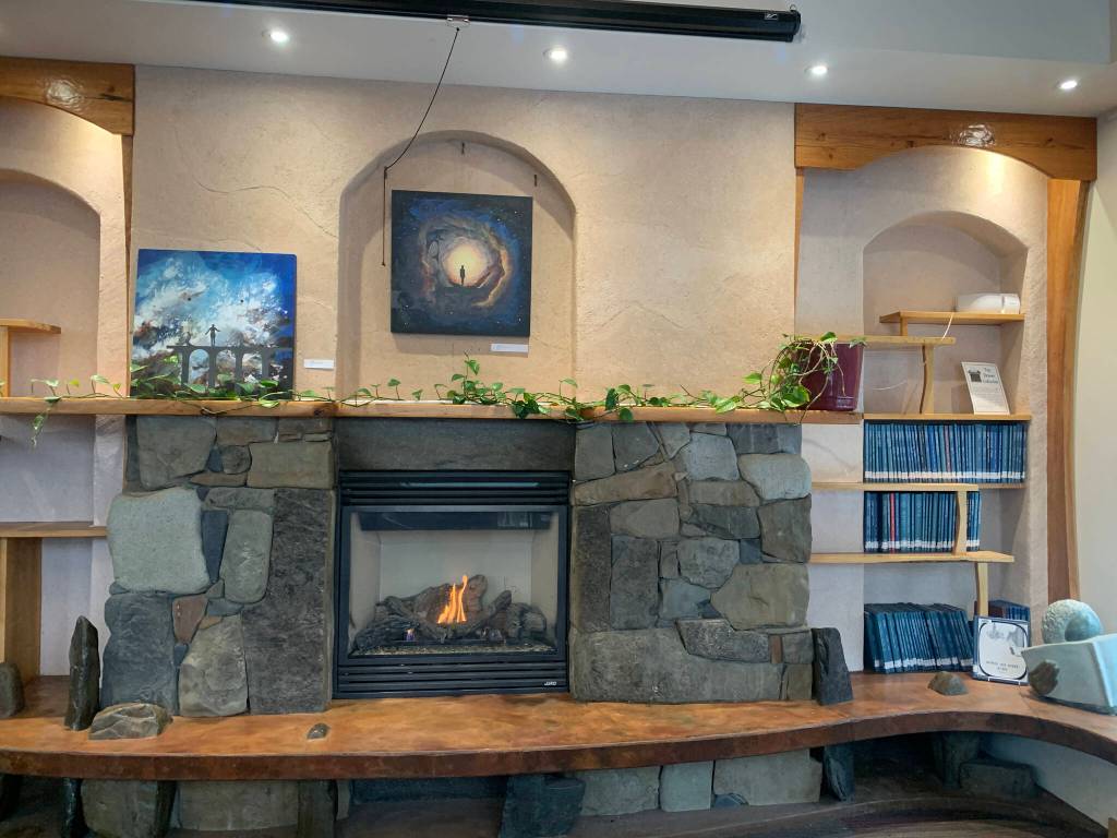 Paintings by Counsel Langely are on display at the Homer Public Library through March, as seen Feb. 11, 2023. (Photo by Christina Whiting/Homer News)