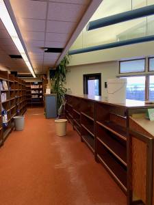 Photo courtesy of Deb Curtis
Bookshelves were moved away from the leaking ceiling in the Homer High School library on Jan. 23.