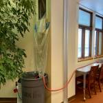 A trash can holds a sump pump that pumps water out of the window in the Homer High School library on Monday, Jan. 23, 2023 in Homer, Alaska. Photo courtesy of Deb Curtis