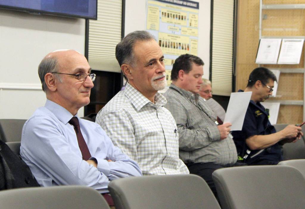 Ashlyn OHara/Peninsula Clarion
Peter Micciche (center) listens to the Kenai Peninsula Borough Assembly certify the results of the Feb. 14, 2023, special mayoral election, through which he was elected mayor of the Kenai Peninsula Borough, on Tuesday in Soldotna.