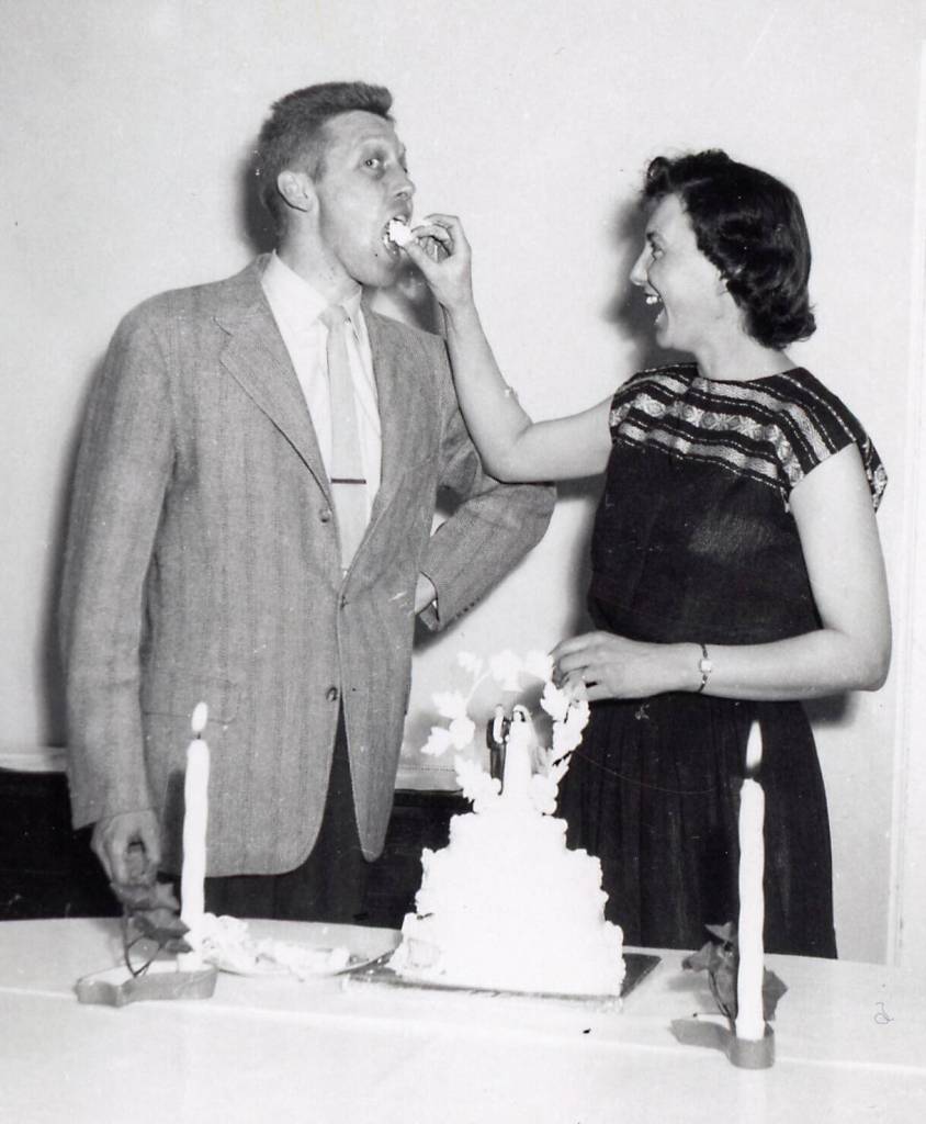 Newly married John and Grace Fenger have a good-natured exchange of wedding cake. They were married in Kodiak during one of the M.S. Hygienes ports of call. (Photo courtesy of the Fenger Family Collection)