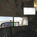 Soldotna High School teacher Jayda Williams operates a flight simulator inside a classroom on Wednesday, Feb. 22, 2023 in Soldotna, Alaska. (Ashlyn OHara/Peninsula Clarion)