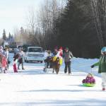 The Anchor Point Snow Rondi Parade proceeds down School Street on Saturday in Anchor Point. (Photo by Delcenia Cosman/Homer News)