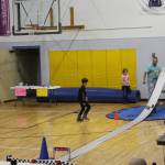 Pinewood derby contestants watch their cars race down the track in the Chapman School gym during the Snow Rondi festival on Saturday<ins>,</ins><ins> March 4 </ins>in Anchor Point<ins>,</ins> <ins>Alaska</ins>. (Photo by Delcenia Cosman/Homer News)