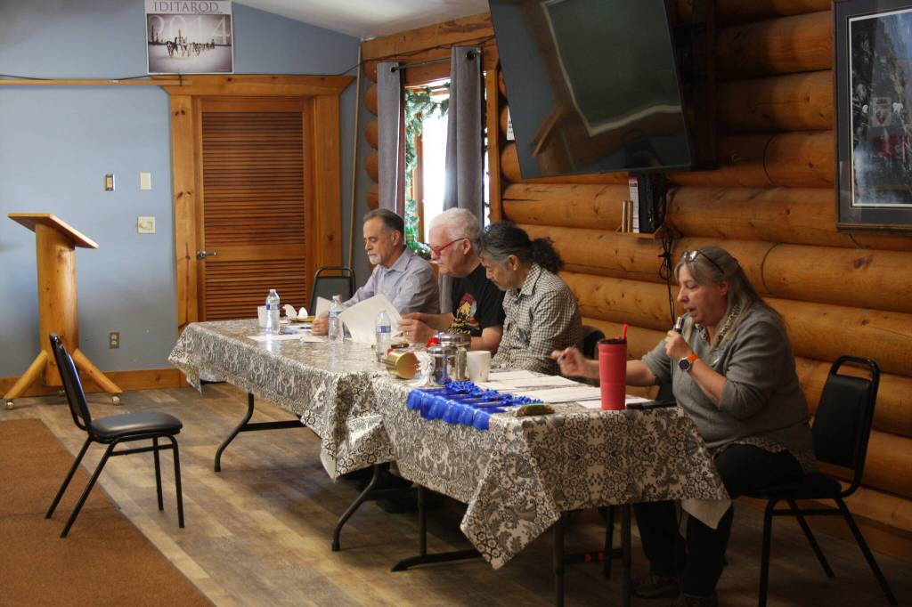 (from left to right) Judges Peter Micciche, Dave Webb and John Down and MC Debbie Poindexter kick off the Snow Rondi dog show on Sunday, March 5 at the Anchor Point Senior Center in Anchor Point, Alaska. Photo by Delcenia Cosman