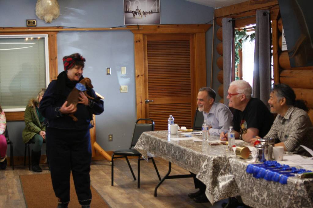 Smallest dog award winner, chiweenie Sammy, is held by his owner Sue Loveland in front of the judges table during the Snow Rondi dog show on Sunday, March 5 at the Anchor Point Senior Center in Anchor Point, Alaska. Photo by Delcenia Cosman