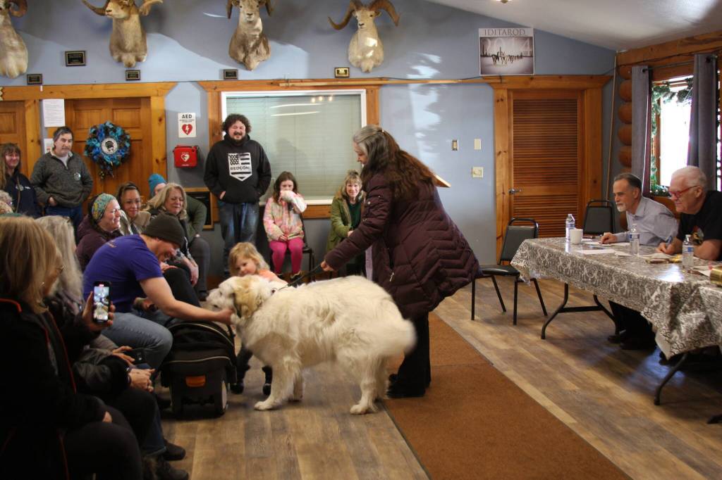 Best manners award winner, Great Pyrenees Bronwyn, says hello to members of the audience with her owner, Julienne Ihly during the Snow Rondi dog show on Sunday, March 5 at the Anchor Point Senior Center in Anchor Point, Alaska. Photo by Delcenia Cosman