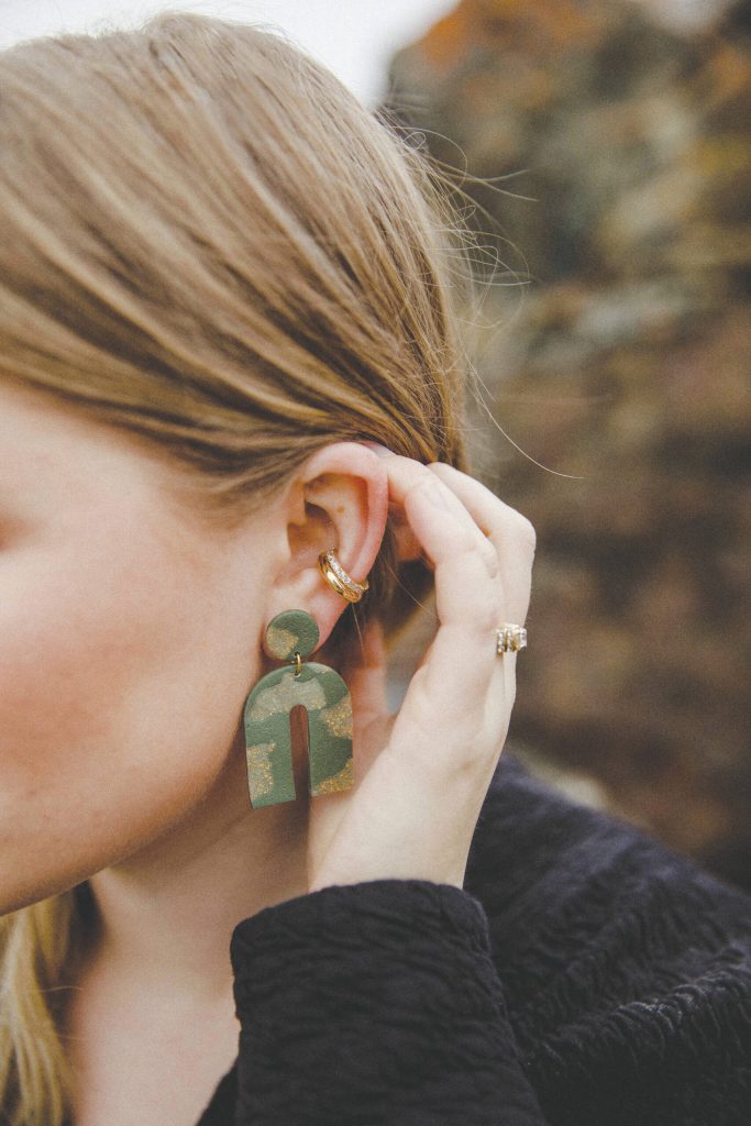 Alyssa Morgan on the Homer Spit modeling a pair of her polymer clay earrings, March 2021. (Photo by Mackenzie Walker of Photos By Kenz)