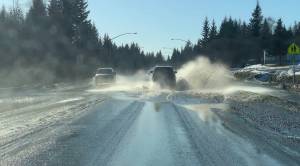 Photo by Christina Whiting/Homer News
<strong>Water fills East End Road from recent snowmelt on Sunday. </strong>